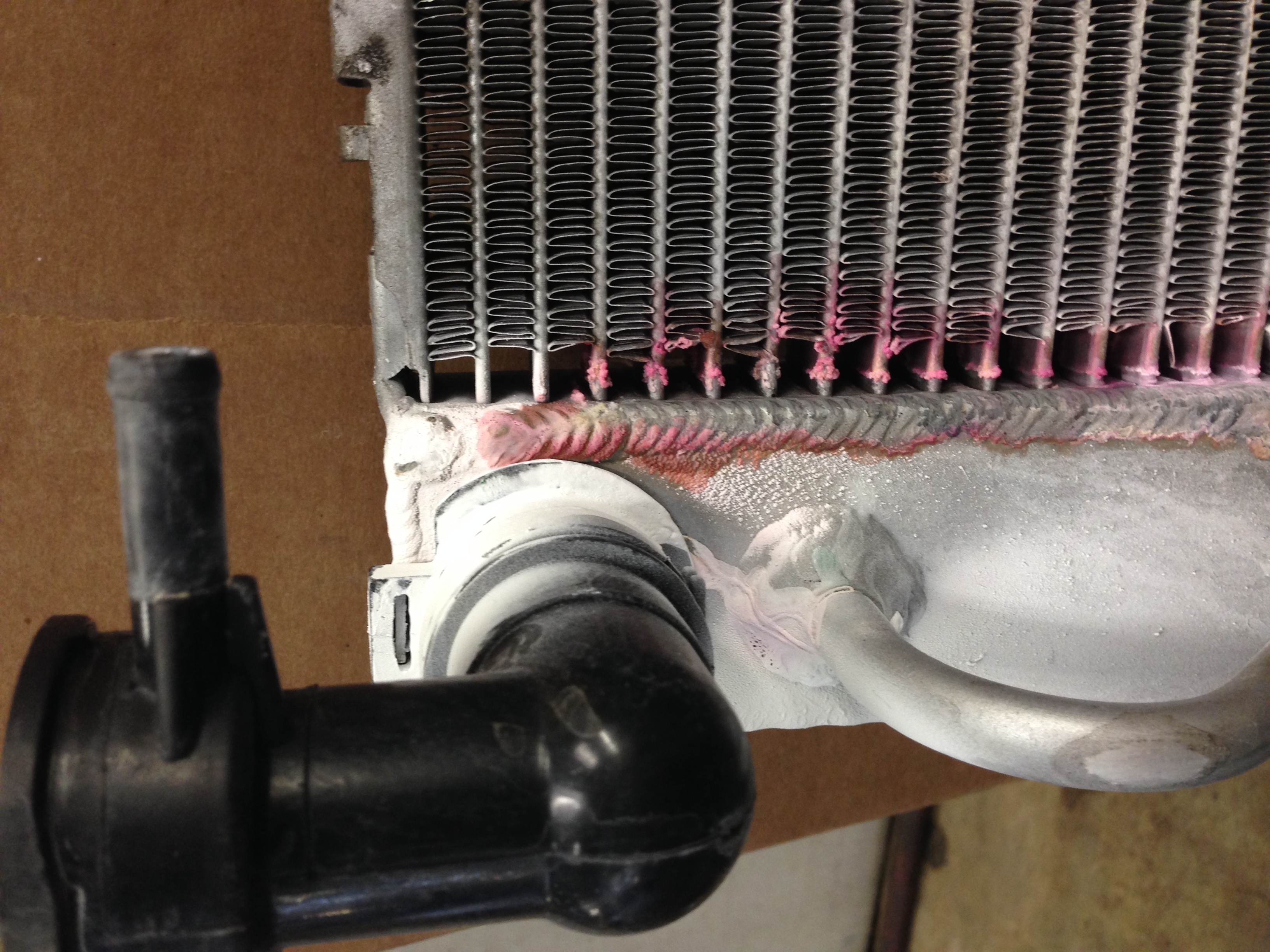 Radiator leaks pink coolant